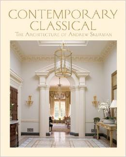Book cover for Contemporary Classical: The Architecture of Andrew Skurman shows an elegant, classical hallway with columns, ornate trim, a gold chandelier, and a view into a sunlit room with drapes. Evoking the harmonious spirit of Classical Music and Modern Classical design, the text is in light serif font above the image.
